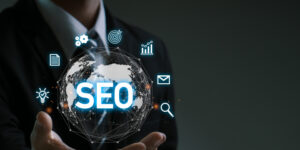 A businessman holding global network with SEO icon illustrates SEO optimization with schema markup.