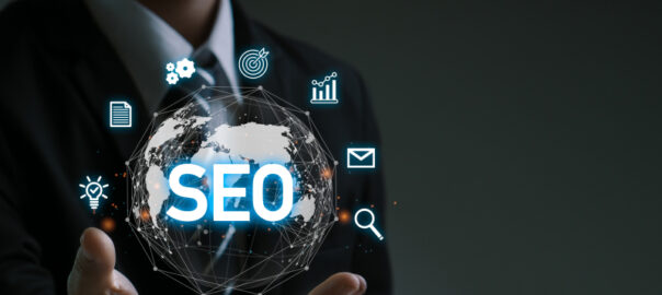 A businessman holding global network with SEO icon illustrates SEO optimization with schema markup.